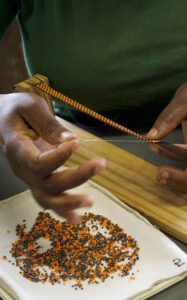 lady making bead product